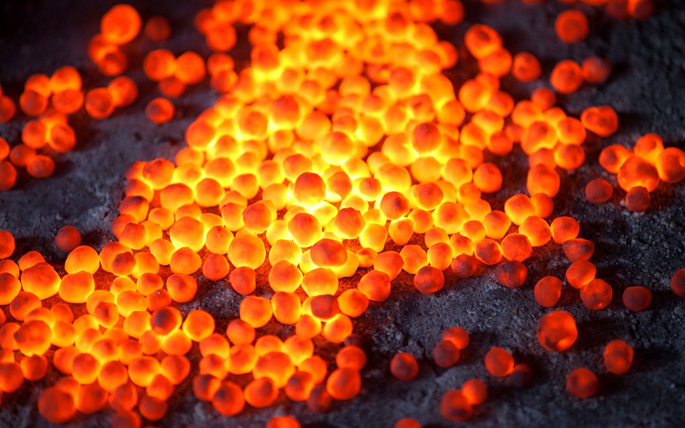 Iron ore pellets leaving the indurating furnace